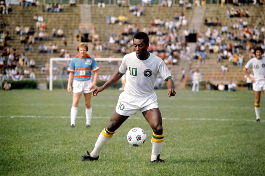 Pelé Gracefully Playing Soccer - Iconic Wallpaper Background