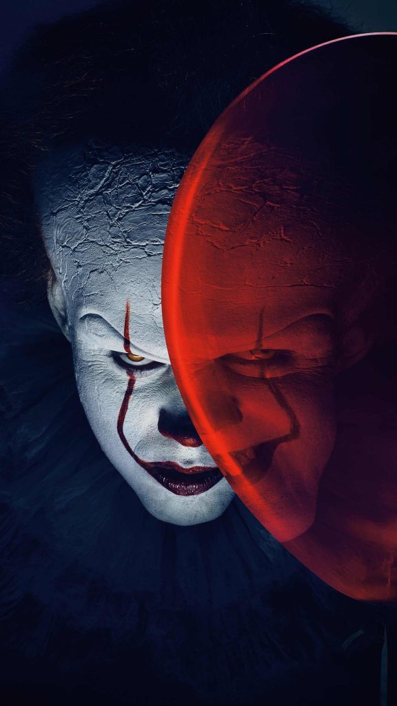 Pennywise close-up with red balloon horror wallpaper dark cinematic scary clown background
