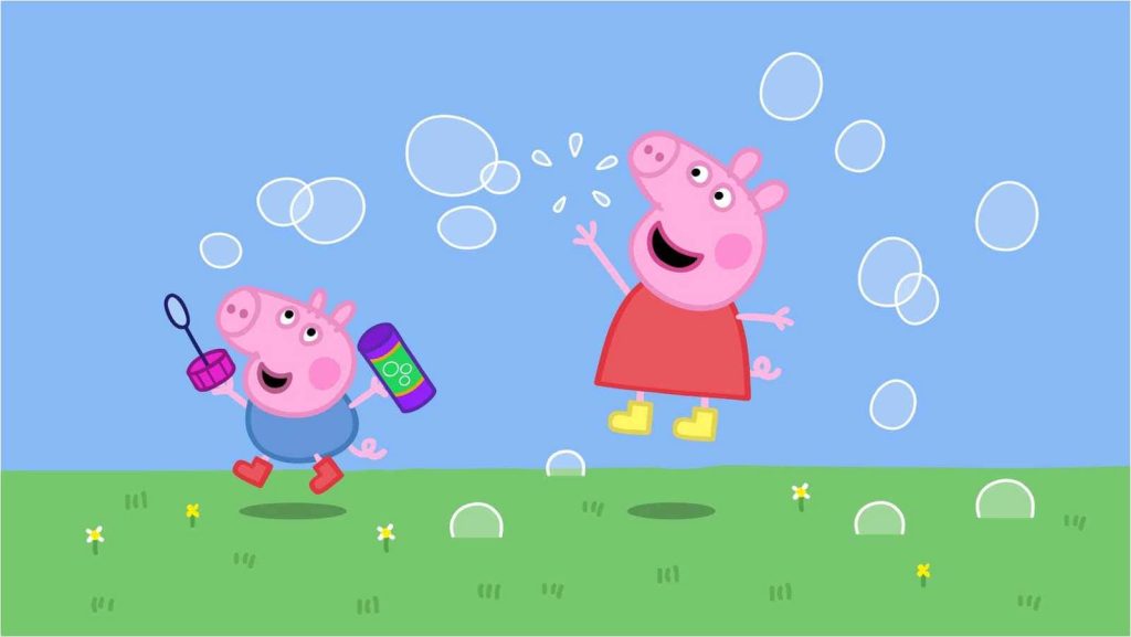 Peppa Pig and George Pig play outdoors chasing bubbles on a sunny grassy meadow wallpaper