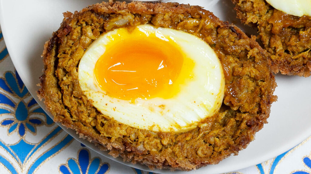 Perfectly Cooked Scotch Egg with Crispy Crust & runny Yolk Wallpaper