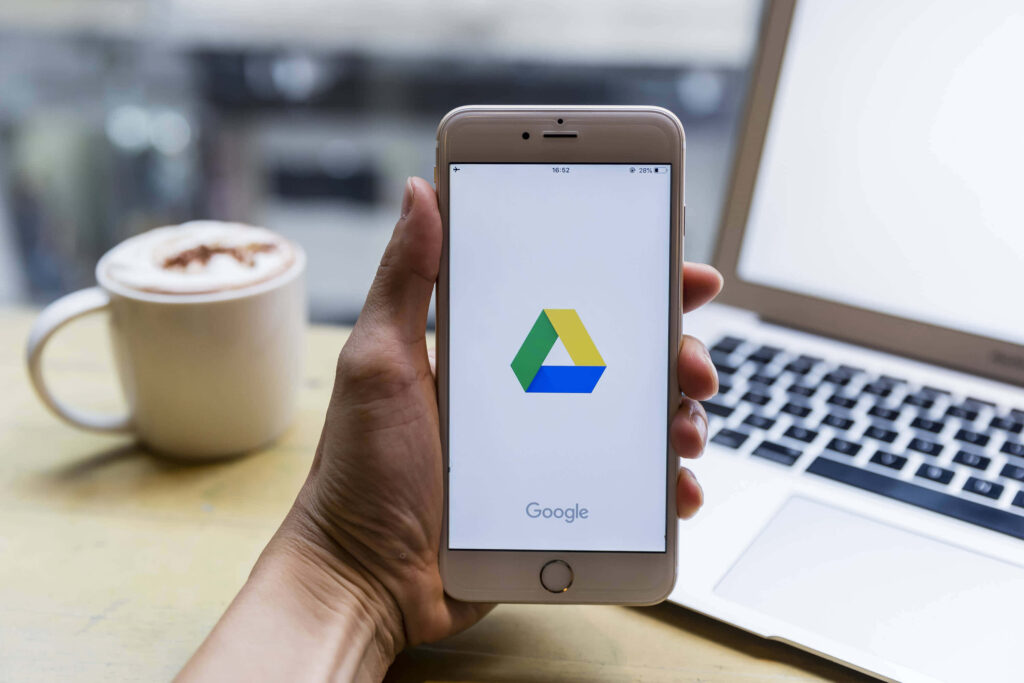 iPhone Displaying Google Drive Logo: Stylish Wallpaper Background