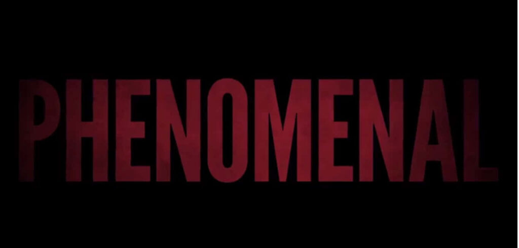 Vibrant Red: The Mesmerizing 'Phenomenal' Embraced by Darkness Wallpaper