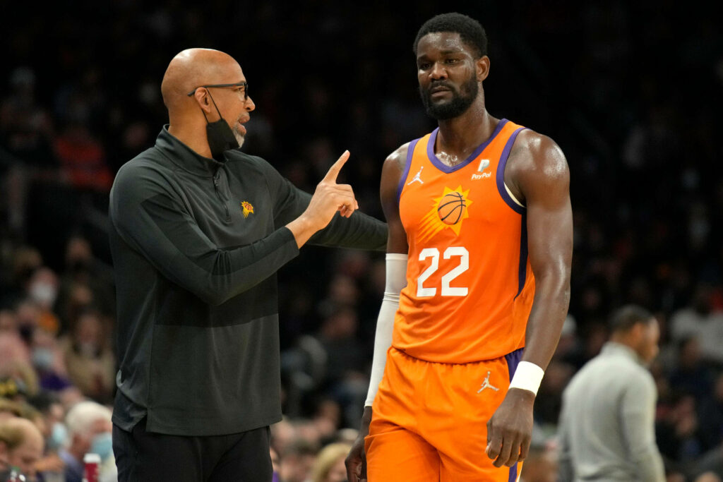 Phoenix Suns coach Monty Williams instructs Deandre Ayton in orange uniforms during NBA game Wallpaper