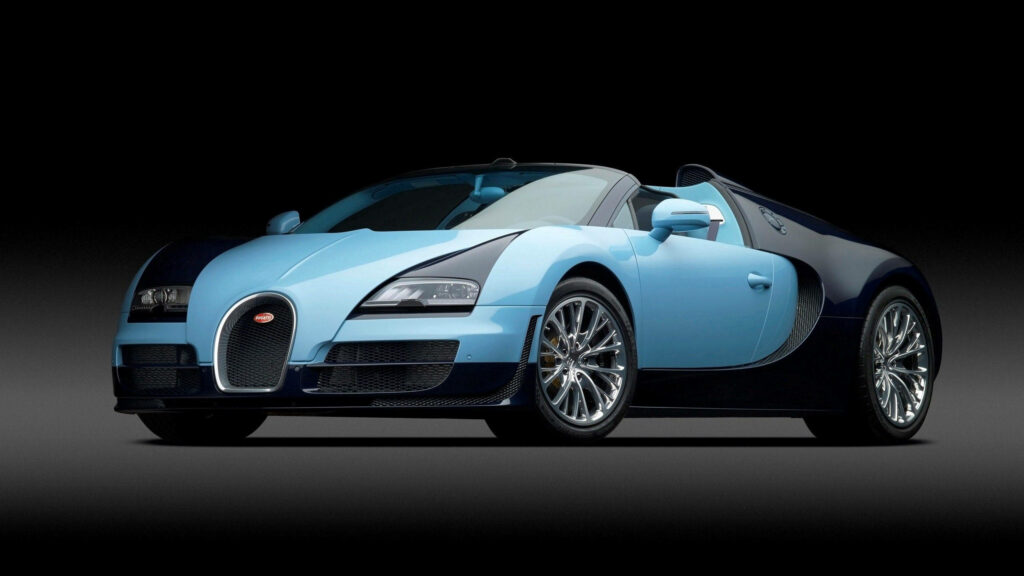 Blue Bugatti Veyron with glossy paint and aerodynamic curves on dark photorealistic wallpaper