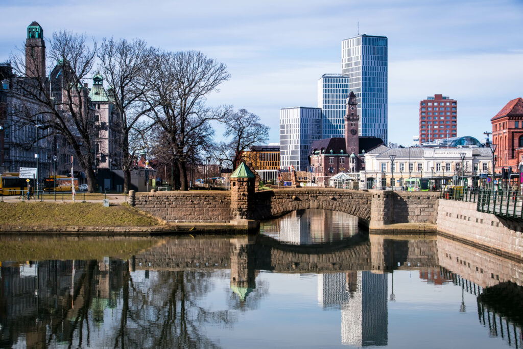 Charming Cityscape Wallpaper: River, Bridge & Blended Architecture