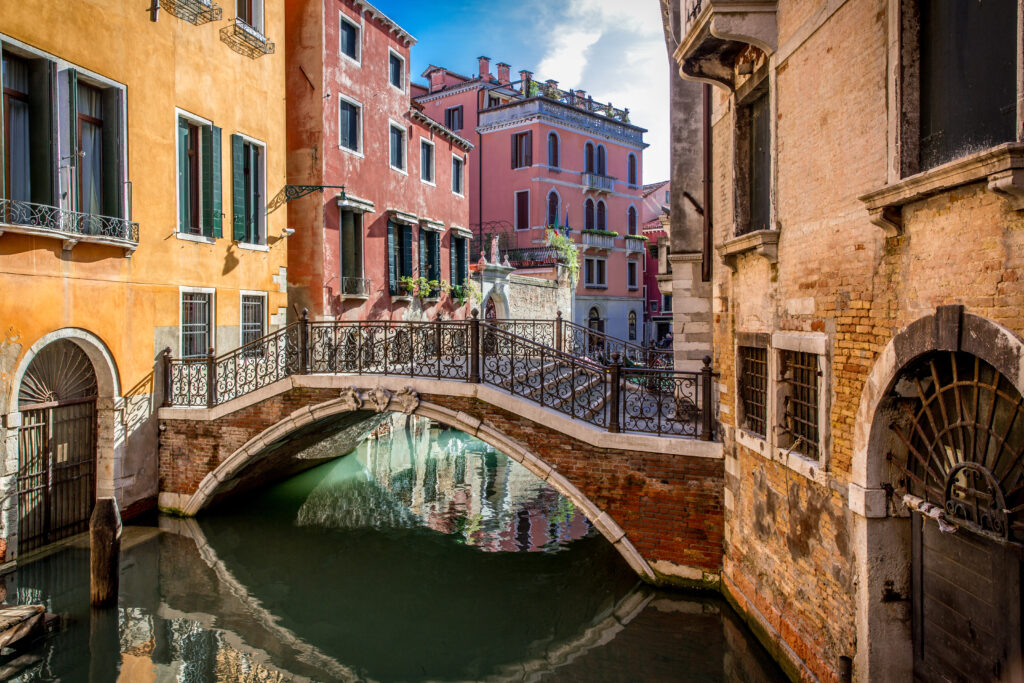 Picturesque Venice Wallpaper: Charming Canal & Historic Bridge Background