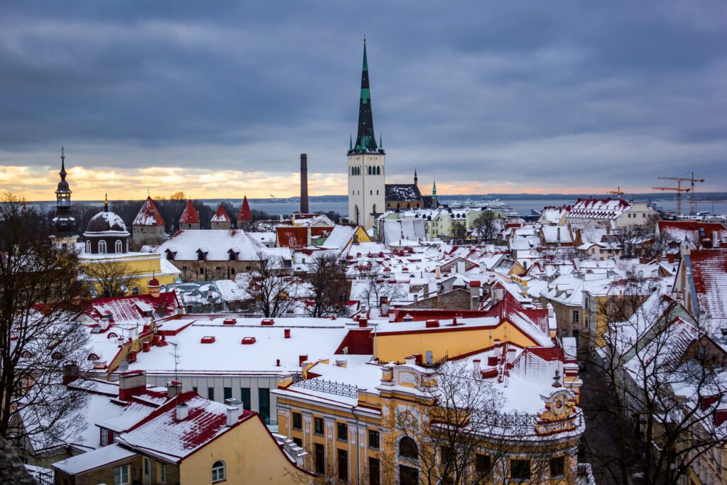 Winter Cityscape Wallpaper: Aerial View of Snow-Covered Architecture