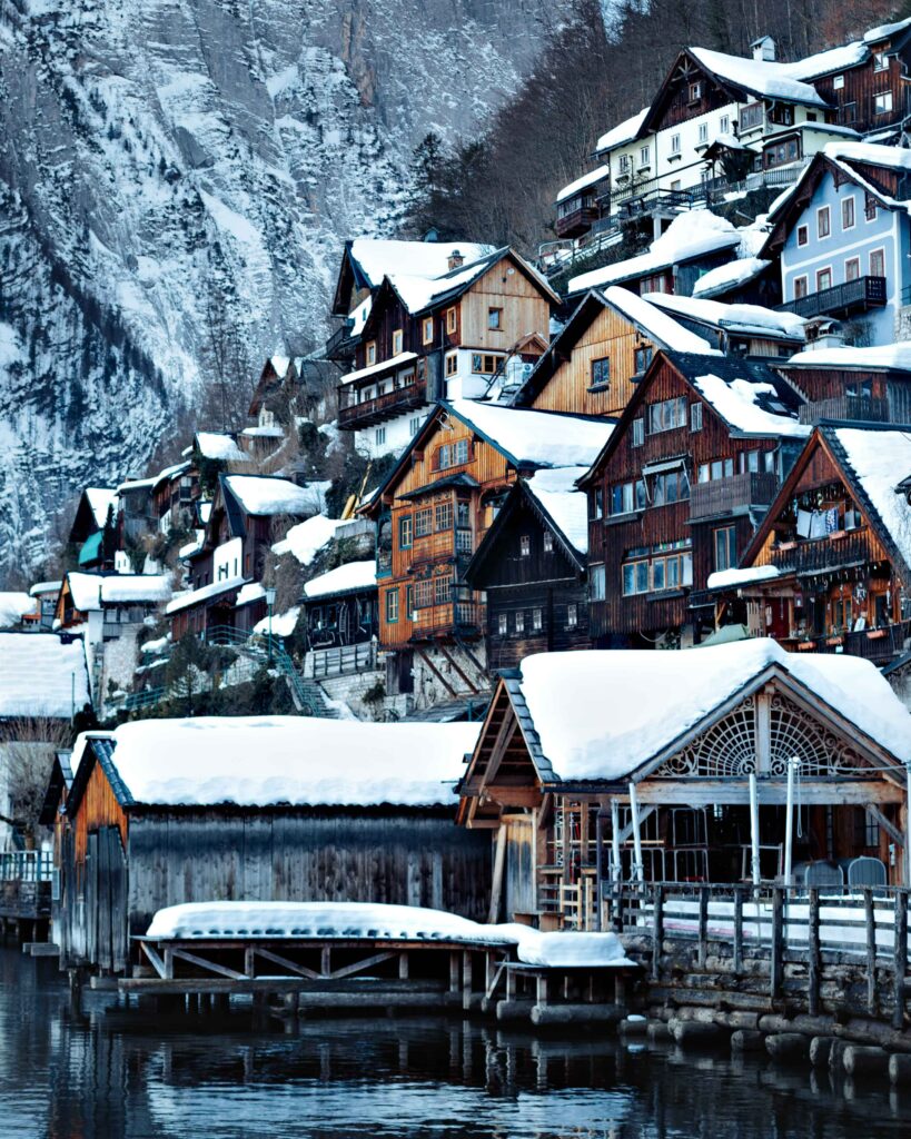 Charming Winter Village Wallpaper: Snowy Mountain Retreat Background