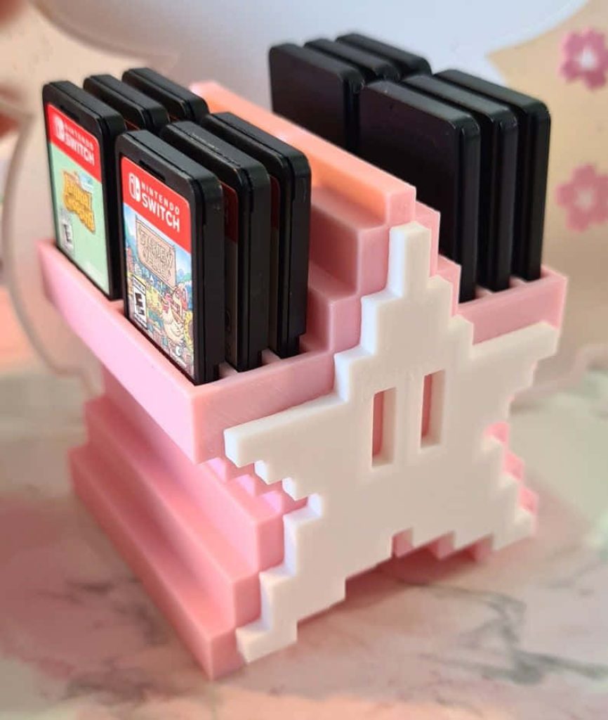 Pink 3D printed Nintendo Switch game cartridge holder with white pixel star and Stardew Valley case Wallpaper