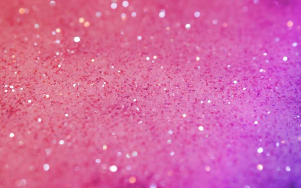 Vibrant hot pink glitter wallpaper with shimmering sparkling particles and soft bokeh effect
