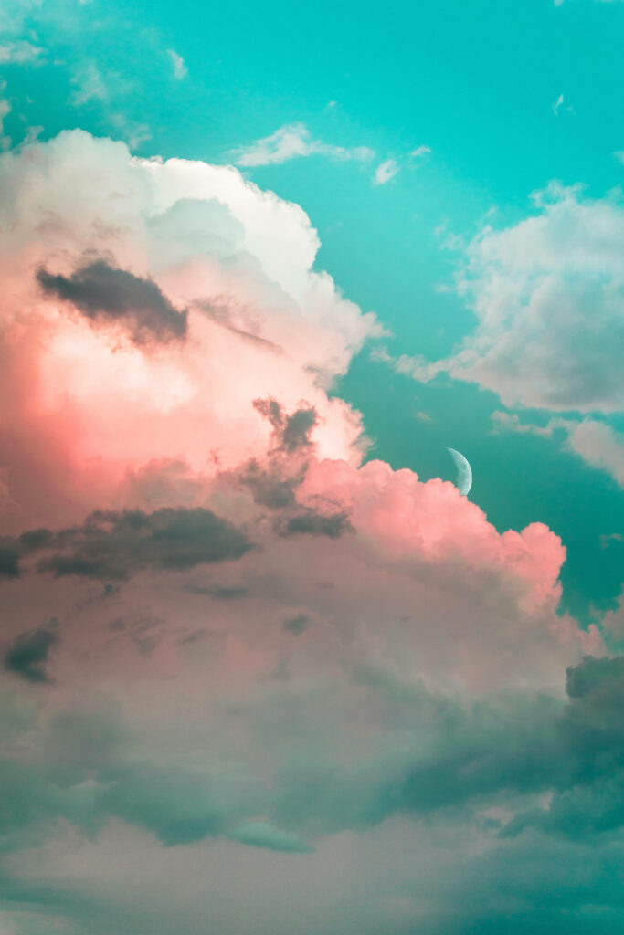 Whimsical Serenity: Captivating Pink Clouds Amid a Verdant Sky - Enchanting 4K Phone Wallpaper