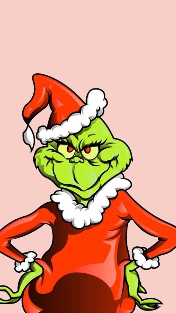 Pink cartoon Grinch in Santa suit with smirk on pastel background festive wallpaper design