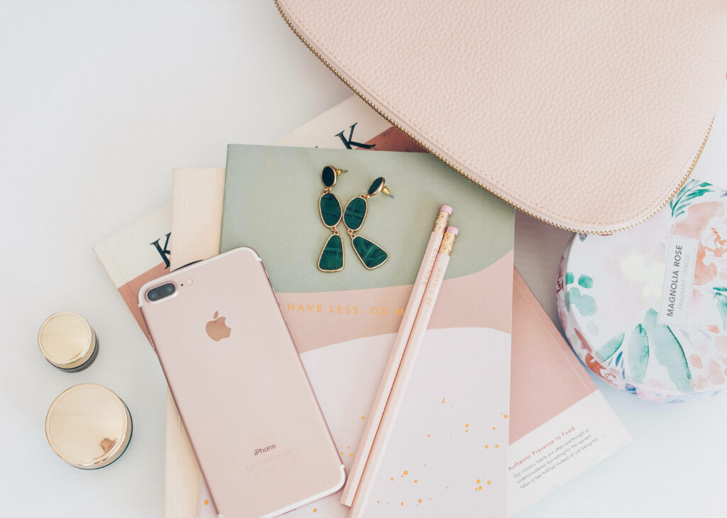 Pretty in Pink: Captivating Aesthetic Wallpaper Featuring a Cool iPhone and Complementary Accessories