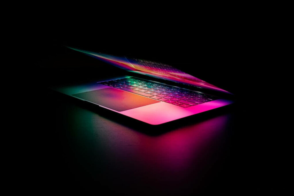 The Sleek Minimally Pink Laptop Radiates Elegance Against a Dark Backdrop - Top Laptop Background Snap Wallpaper