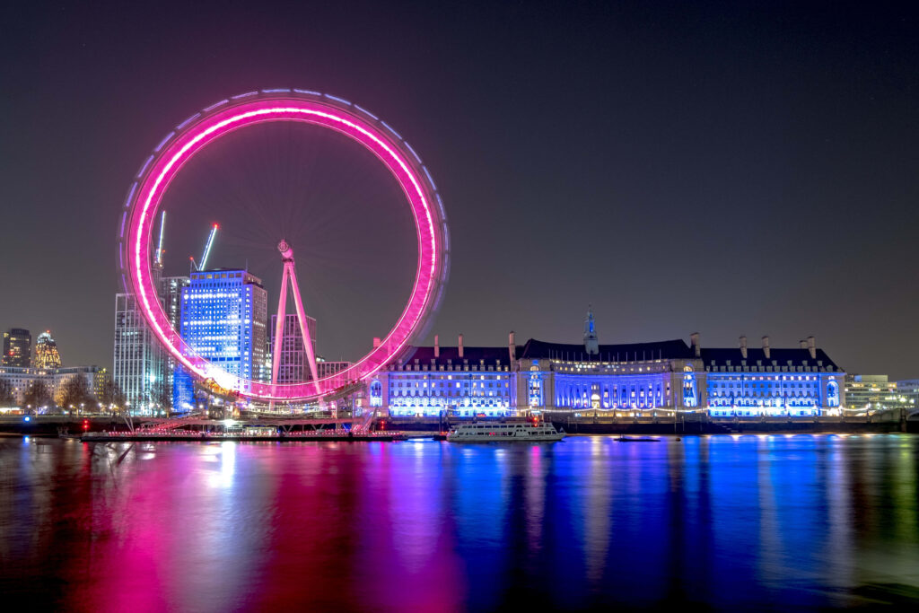 Enchanted Evening: London Eye adorned in Pink Lights Wallpaper