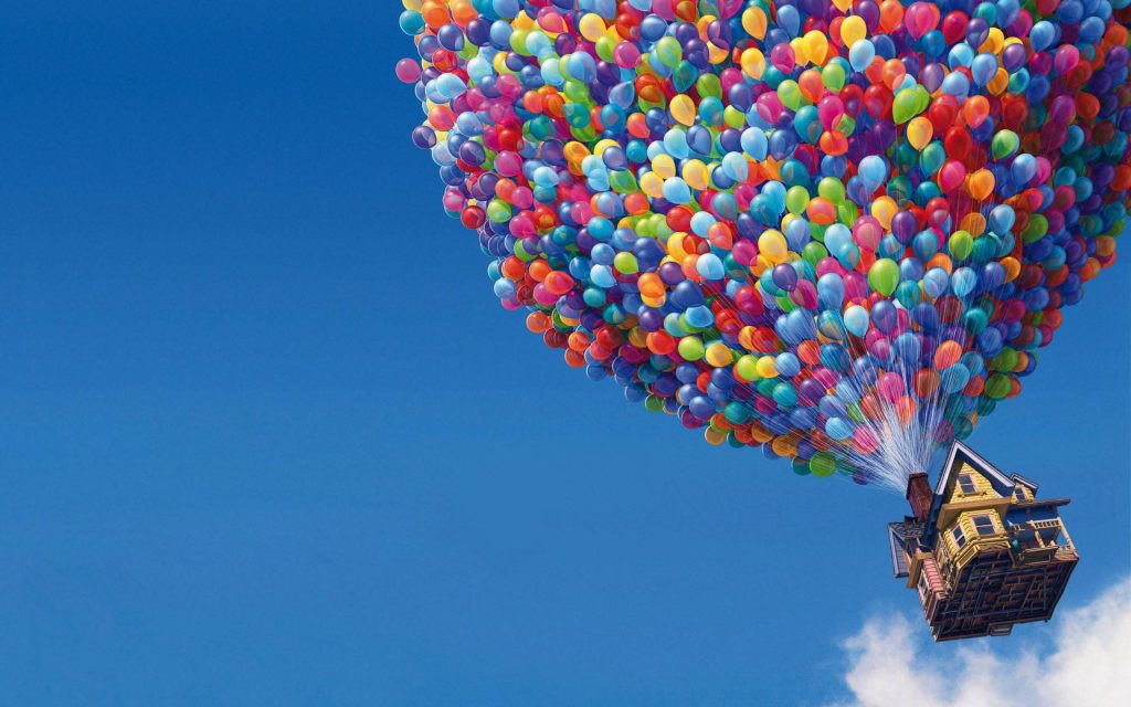 Pixar Up wallpaper with Carl Fredricksen’s floating house and colorful balloons in blue sky