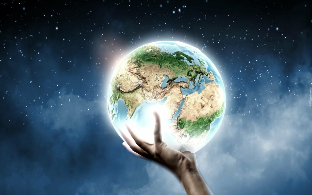 Earth's Tender Embrace: A Captivating HD Wallpaper of a Planet Resting in the Palm of a Hand