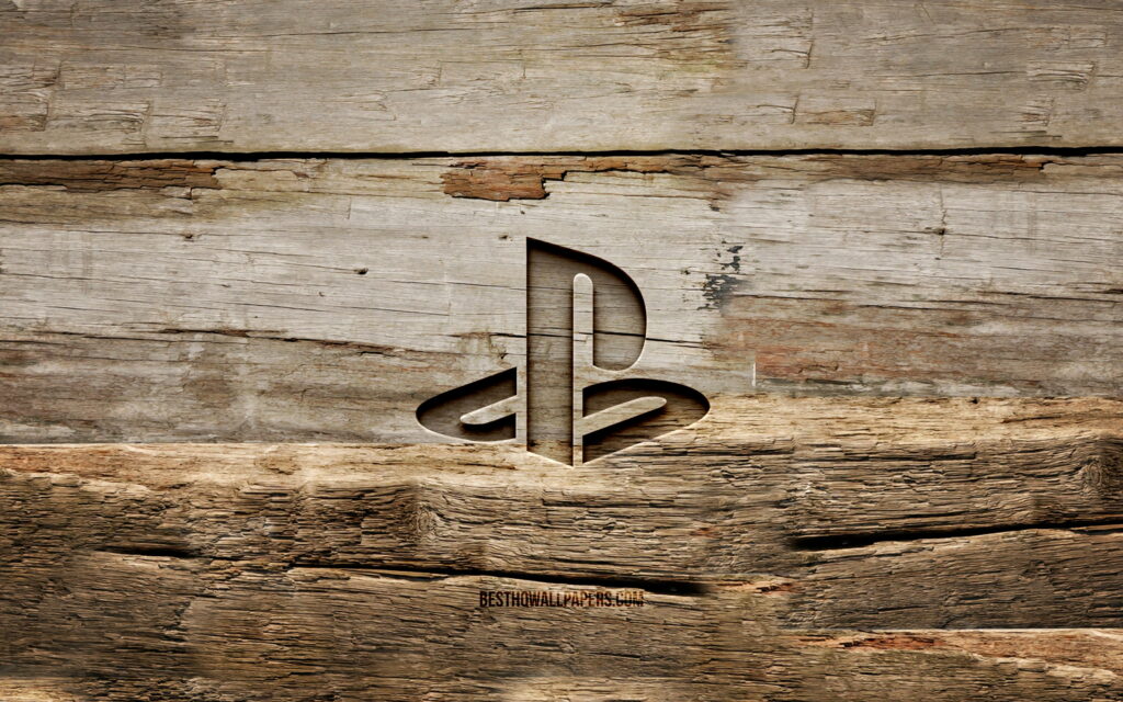 PlayStation: A Creative Blend of Technology and Craftsmanship on a Wooden Canvas Wallpaper