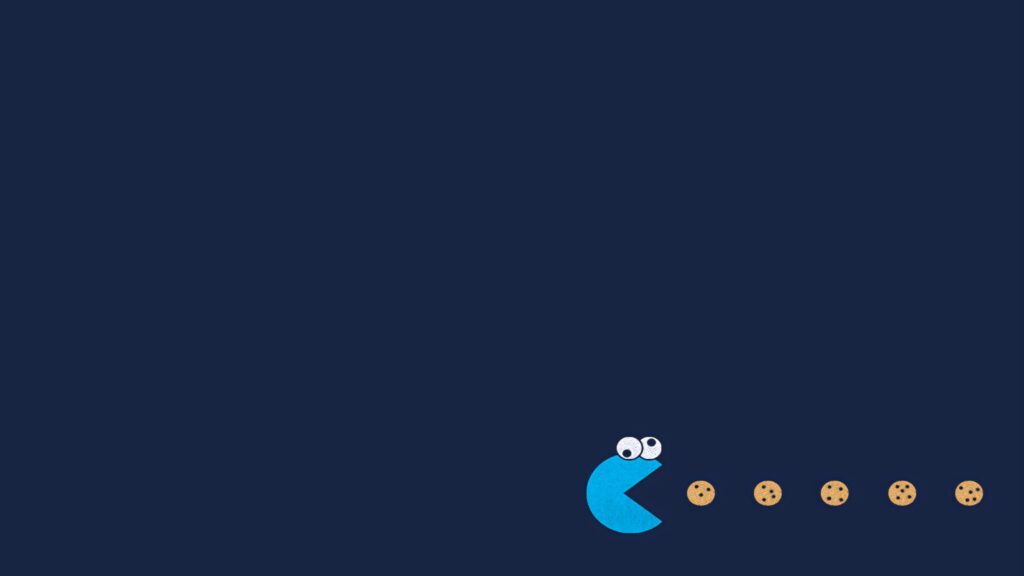 Cookie Monster Pac-Man style wallpaper with blue character chasing chocolate chip cookies on navy background