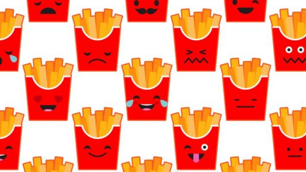 Colorful cartoon French fries containers with cute faces pattern on white wallpaper background
