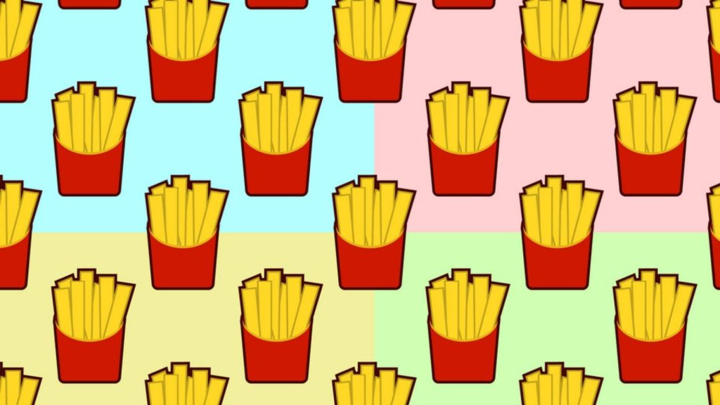 Playful French fries wallpaper with red containers on colorful pastel pop art grid background