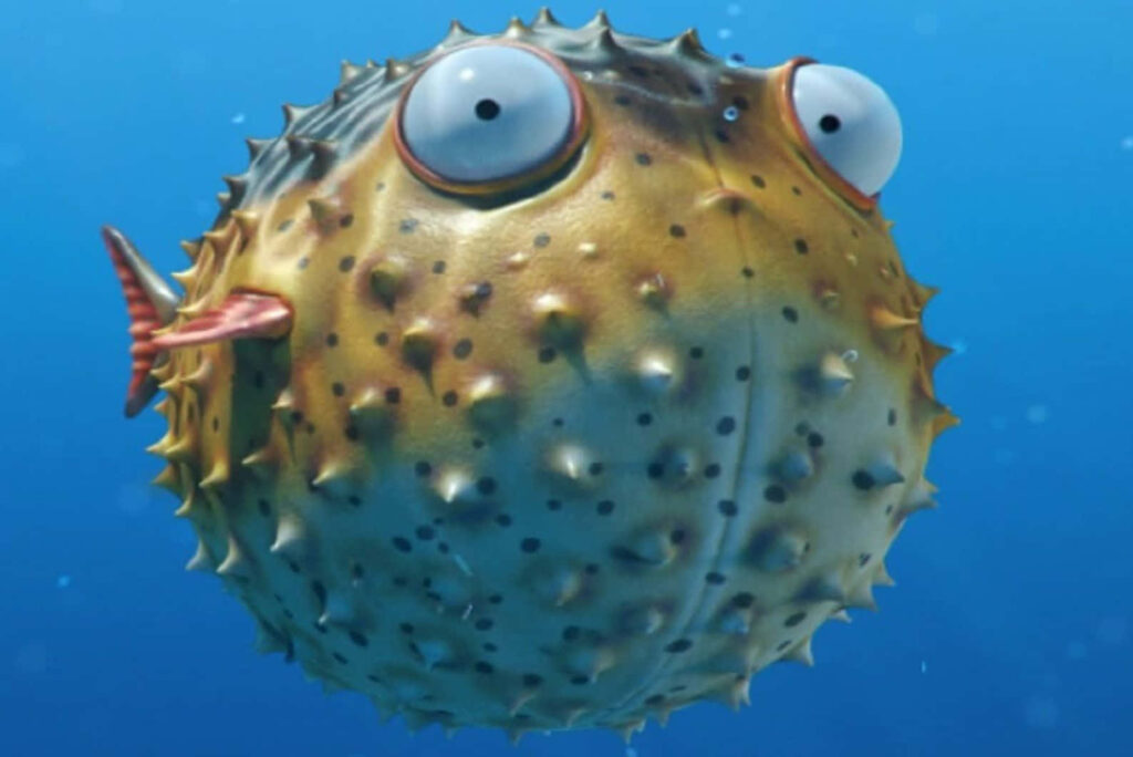 Colorful inflated blowfish underwater with spiky body and wide eyes in blue ocean background Wallpaper
