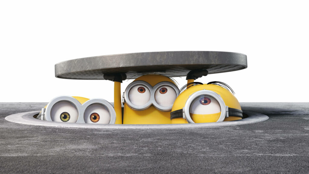 Playful Minions Wallpaper: Curious Creatures from Despicable Me!