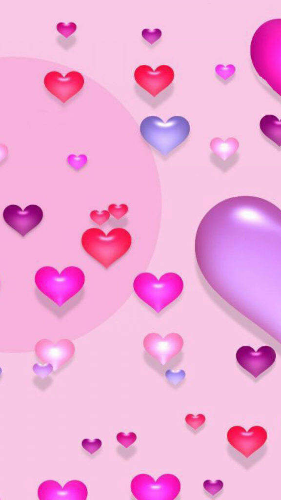 Colorful Heart Patterns on Pink iPhone Wallpaper - Playful & Cute