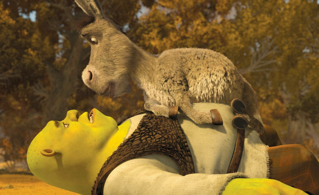 Colorful Shrek Wallpaper: Donkey's Fun Moment in a Lively Forest