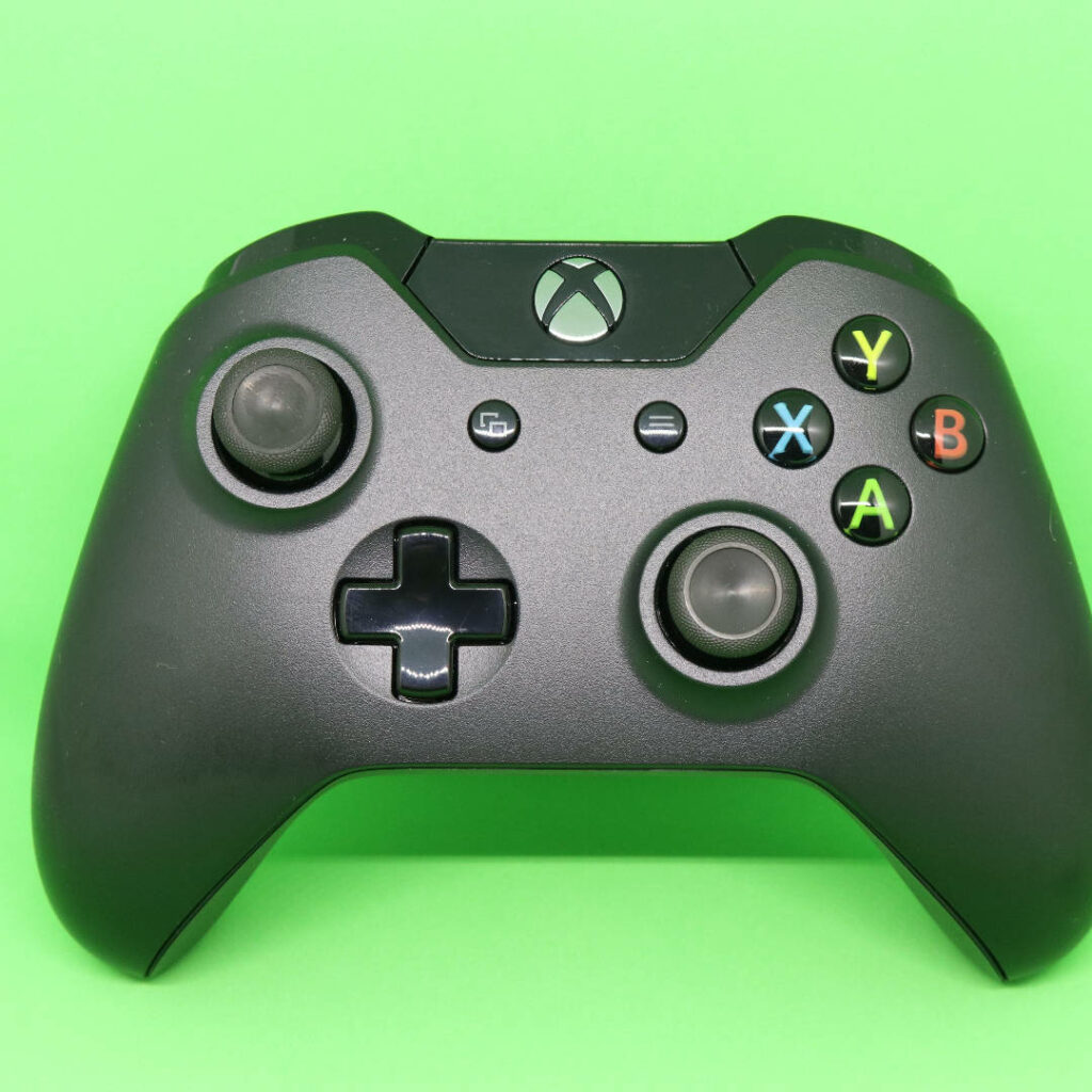 Game On: Xbox Controller Finds Serene Oasis on Green Canvas Wallpaper