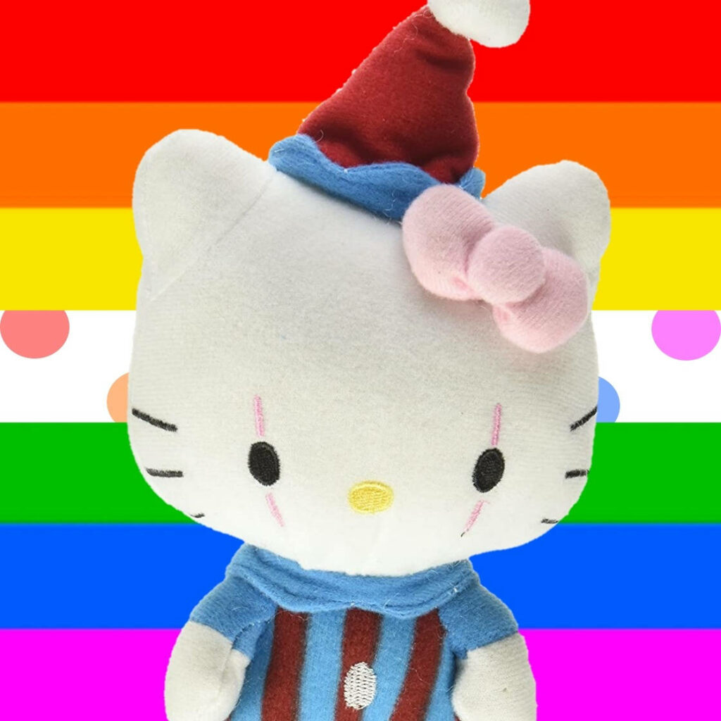 Colorful Cat Clown Wallpaper: Plushy Character on Rainbow Background
