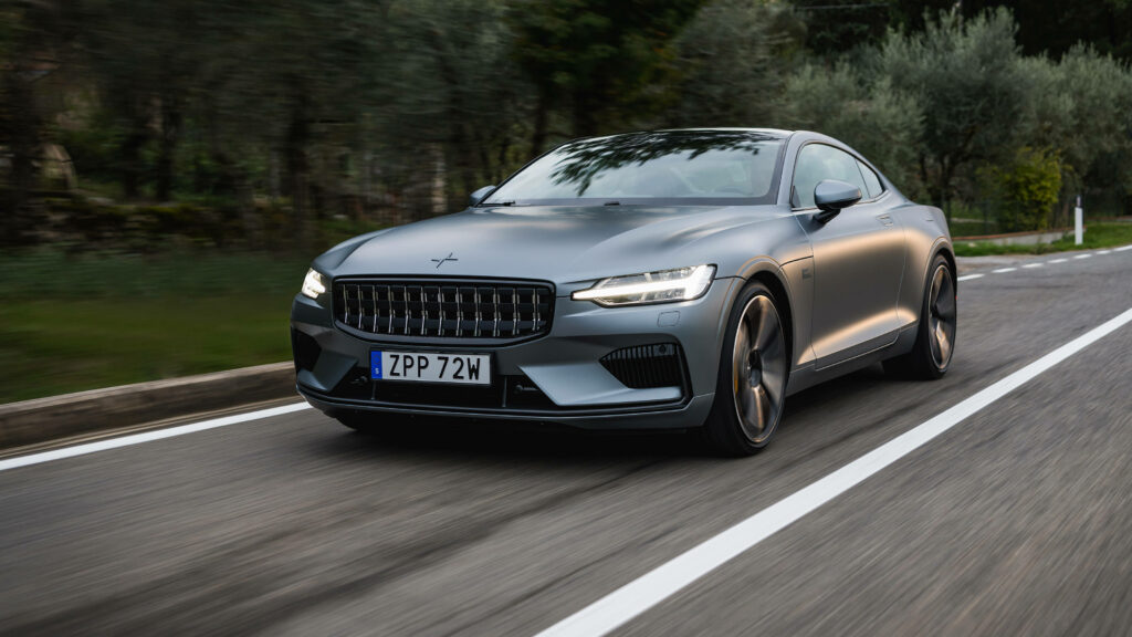 Polestar 1 matte finish driving on scenic road with sleek lines and streamlined design wallpaper