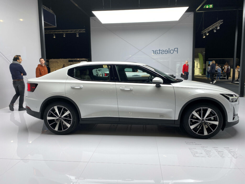 Side view of Polestar 2 electric car showcasing modern design and stylish details in showroom Wallpaper