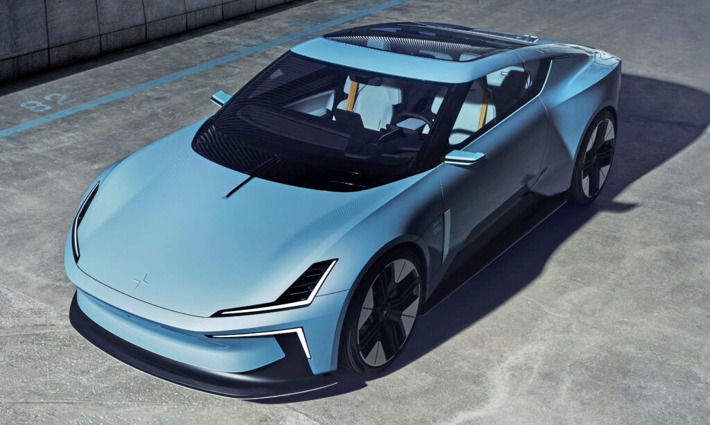 Polestar O2 Convertible blue car with sharp LED lights and aerodynamic design in urban setting Wallpaper