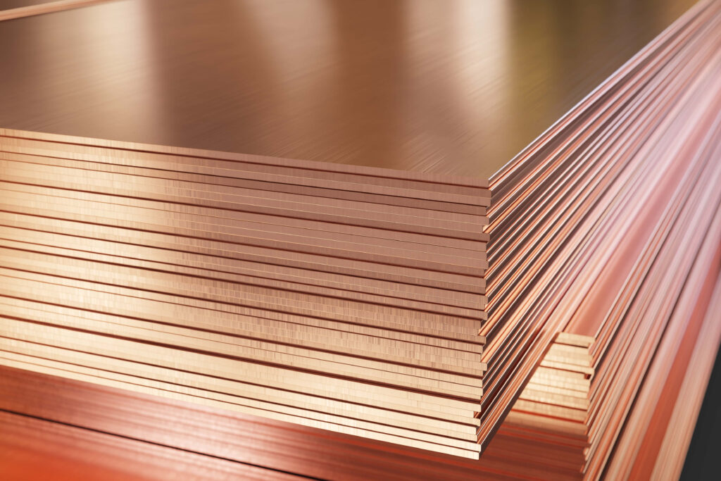 Stack of polished copper sheets with warm metallic hues smooth reflective finish wallpaper background