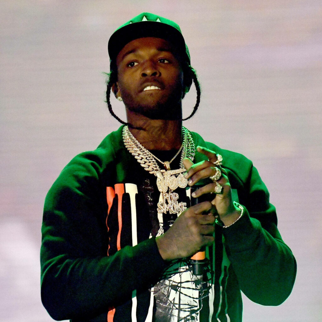 Capturing Pop Smoke's Electric Performance: Mic in Hand on Concert Stage Wallpaper