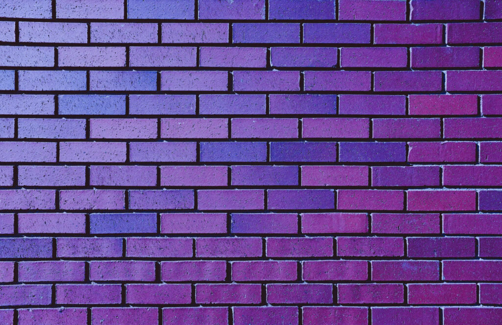Neon purple brick wall wallpaper with violet magenta gradient modern urban textured background