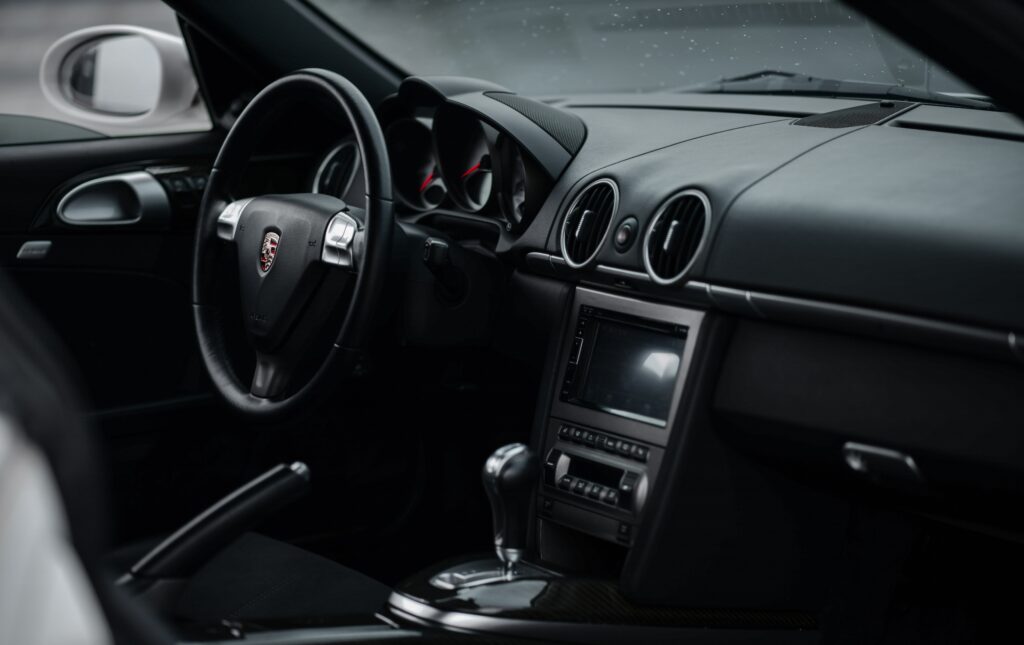 Porsche Cayman S Interior: Luxurious Dashboard & Steering Wheel Focus Wallpaper