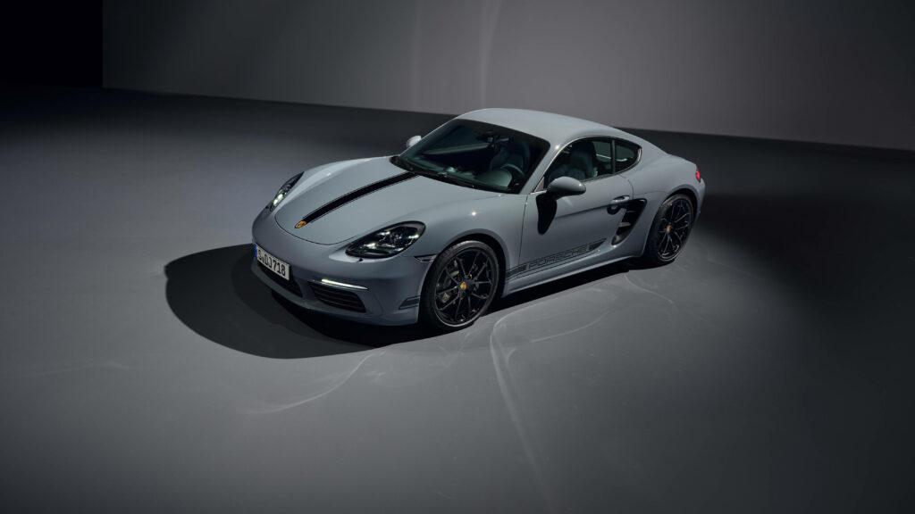 Sleek Porsche Cayman sports car in modern studio lighting detailed 4K laptop wallpaper background