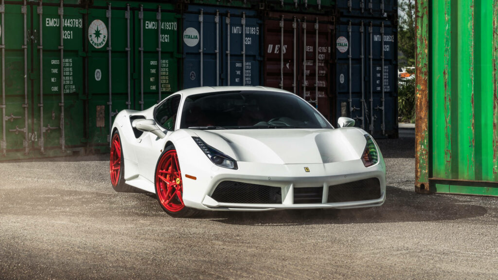 Portside Thrill: White Ferrari 488 on Red Rims Takes on Shipping Container Maze Wallpaper