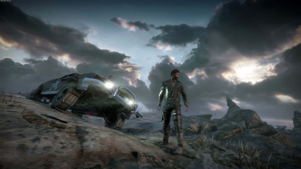 Lone wanderer by rugged vehicle in barren desert wasteland under stormy post apocalyptic sky Wallpaper