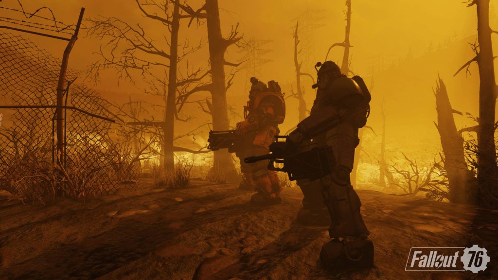 Fallout 76 wallpaper Power Armor soldiers in toxic orange post-apocalyptic wasteland scene