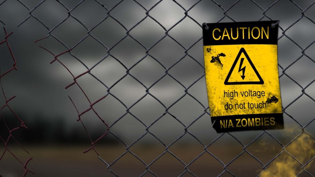 Post-apocalyptic digital wallpaper with damaged fence high voltage zombie caution sign dark sky