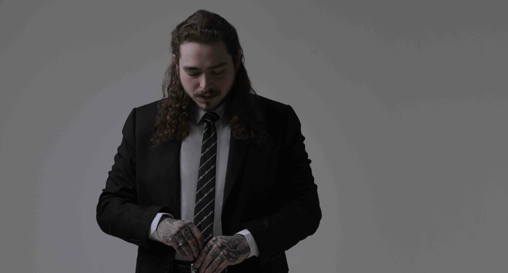 Inked Melodies: Post Malone Dons His Signature Tattoos in HD Wallpaper