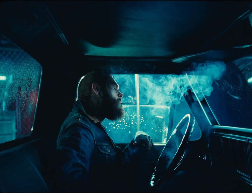Post Malone Cinematic Wallpaper: Dimly Lit Neon Vehicle Scene