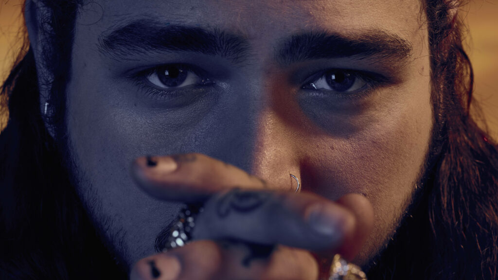 Post Malone Close-Up Wallpaper: Intense Gaze & Signature Tattoos