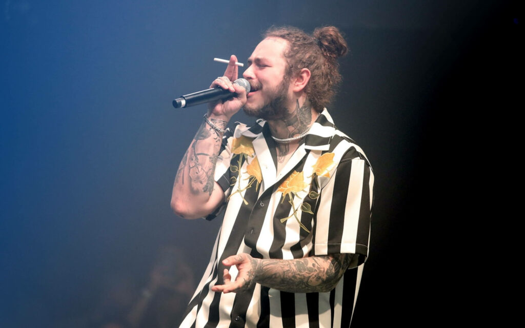 Vibrant Post Malone Concert Wallpaper: Mid-Performance Style