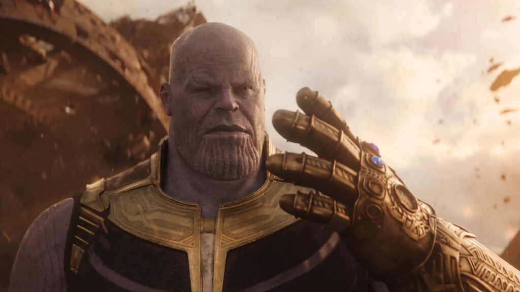 Dynamic Clash of Power Stone Heroes: Epic Battle Unleashed on a Stunning Thanos Desktop Wallpaper