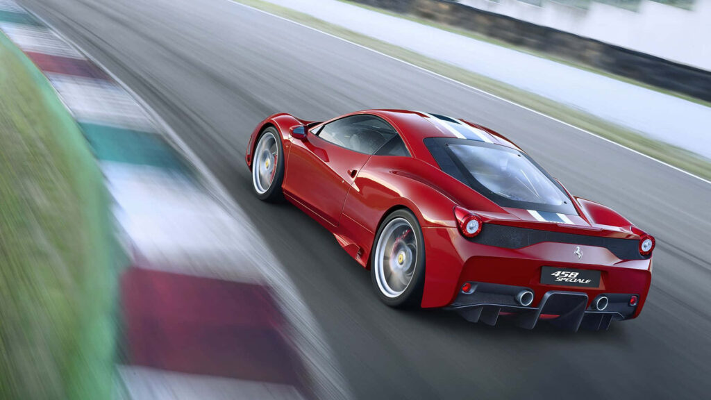 Ferrari 458 Speciale Roars on a Race Track Background Wallpaper