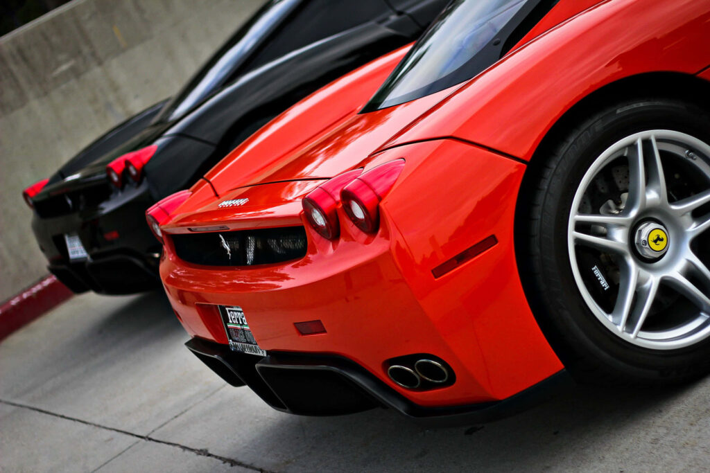 Red and Black Ferrari Enzo Parked Background Wallpaper